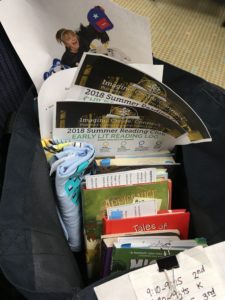 A peek inside an outreach bag of books