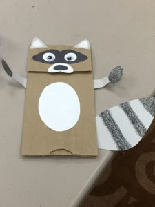 Raccoon puppet made from a paper bag.
