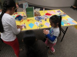 Kids doing the Make a Kite craft