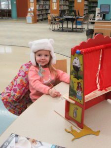 Playing with stick puppets at the Imagination Hub