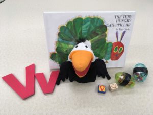 Book, vulture puppet, letter V, rubber stamps, shaker eggs