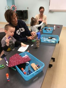 kids and their adults making puppets with recycled materials 2