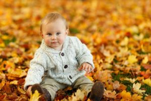 toddler with golden leaves from Pixabay
