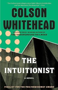 Book cover for Colson Whitehead's The Intuitionist. A pair of grey buildings are highlighted against a green background.