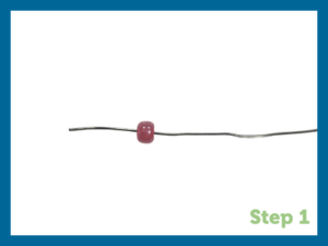 a pink bead on wire