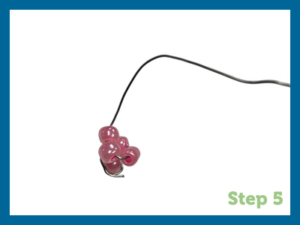 pink beads wrapped around wire
